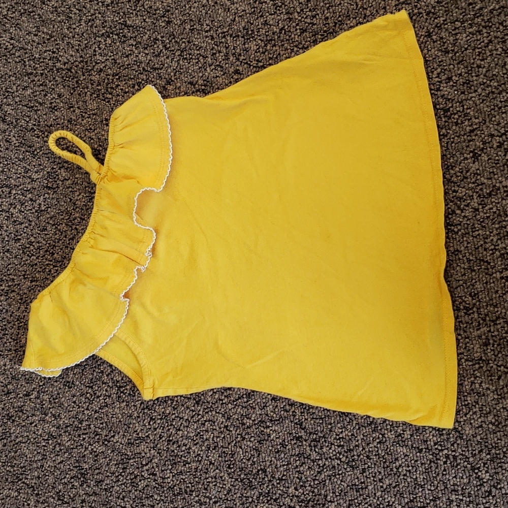 2 items: Arizona yellow top with off sleeve shoulder and Justice Dance shirt